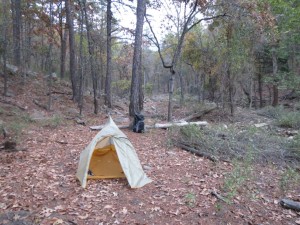 A leave no trace campsite near a dry creek bed.